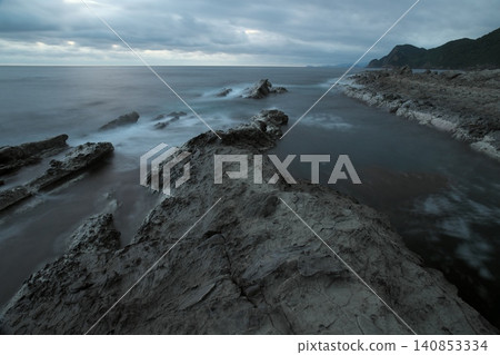 A dramatic morning scene during the rainy season on the coast of Izumo City, Shimane Prefecture. A dramatic morning scene during the rainy season on the coast of Izumo City, Shimane Prefecture. 140853334