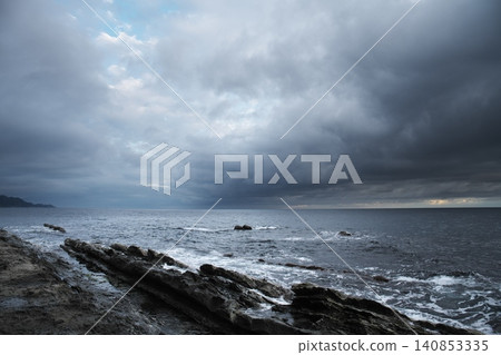 A dramatic morning scene during the rainy season on the coast of Izumo City, Shimane Prefecture. A dramatic morning scene during the rainy season on the coast of Izumo City, Shimane Prefecture. 140853335