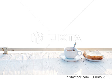 A cup of hot coffee with toast bread in white dish on white wooden counter bar isolated on white background with clipping path A cup of hot coffee with toast bread in white dish on white wooden counter bar isolated on white background with clipping path 140853598