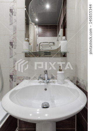 Bathroom Interior with Ceramic Washbasin Sink and Mirror close up Bathroom Interior with Ceramic Washbasin Sink and Mirror close up 140855344