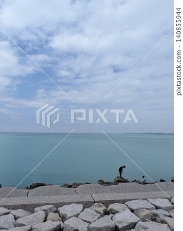 Enjoying a relaxing day of fishing at the sea on your day off. Enjoying a relaxing day of fishing at the sea on your day off. 140855944