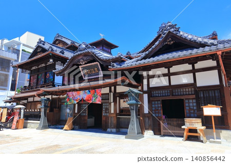 [Ehime Prefecture] Dogo Onsen Main Building under a clear blue sky after renovations 140856442