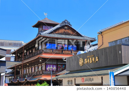 [Ehime Prefecture] Dogo Onsen Main Building under a clear blue sky after renovations 140856448