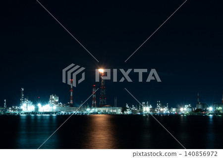 The night view of the Yokkaichi industrial complex, illuminated by the flames of a flare stack. The night view of the Yokkaichi industrial complex, illuminated by the flames of a flare stack. 140856972