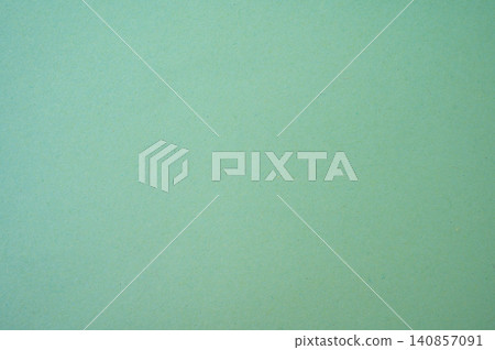 Full frame shot of light green paper sheet. Colored paper or construction paper, is a type of paper that comes in a wide range of colors. Full frame shot of light green paper sheet. Colored paper or construction paper, is a type of paper that comes in a wide range of colors. 140857091
