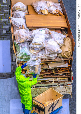 Apartment renovation in Yokohama, Japan. Waste materials are being loaded onto trucks one after another. (Yokohama city) Apartment renovation in Yokohama, Japan. Waste materials are being loaded onto trucks one after another. (Yokohama city) 140857252