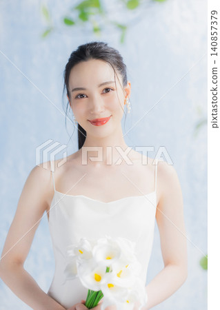Young woman in a wedding dress Young woman in a wedding dress 140857379