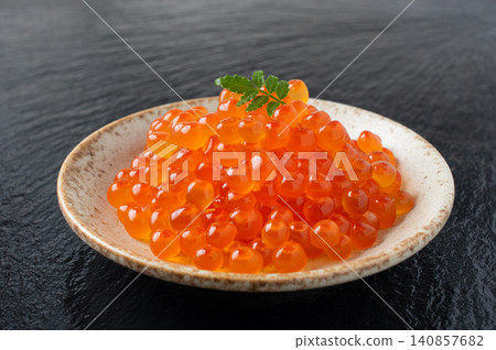 Salmon roe served on a small plate Salmon roe served on a small plate 140857682