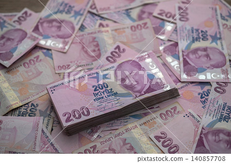 Piles of colorful Turkish lira notes create a vibrant display in busy financial Piles of colorful Turkish lira notes create a vibrant display in busy financial 140857708