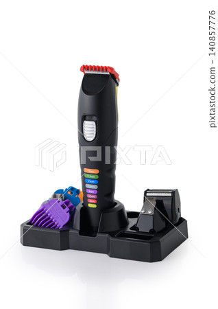 Professional Hair Clipper Set with Adjustable Guides and Accessories Isolated on White Professional Hair Clipper Set with Adjustable Guides and Accessories Isolated on White 140857776