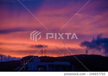 Fiery Dramatic Sunset with Deep Purple and Orange Skies Over Tbilisi Cityscape Fiery Dramatic Sunset with Deep Purple and Orange Skies Over Tbilisi Cityscape 140857783
