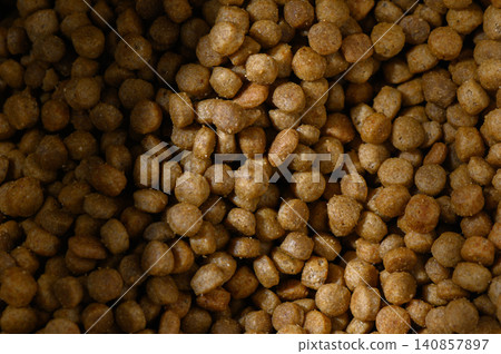Dog food in a large container showcases the wholesome nourishment for furry companions Dog food in a large container showcases the wholesome nourishment for furry companions 140857897