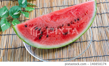 A refreshing dessert featuring sliced watermelon, evoking the image of summer. A refreshing dessert featuring sliced watermelon, evoking the image of summer. 140858174
