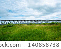 A railway bridge surrounded by greenery 140858738