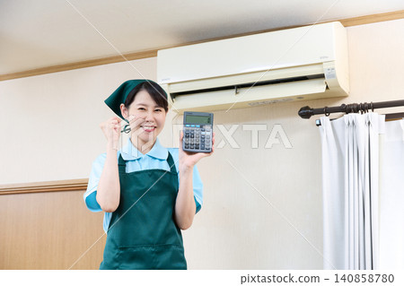 A female staff member is pleased with the price of the air conditioner cleaning. A female staff member is pleased with the price of the air conditioner cleaning. 140858780