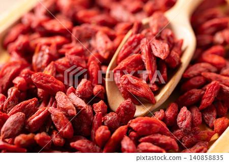 Organic dried goji berries in a wooden scoop. Healthy food Organic dried goji berries in a wooden scoop. Healthy food 140858835