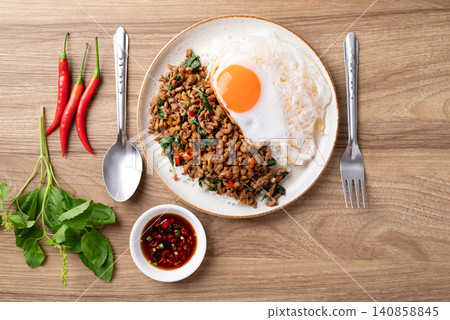 Thai food, Stir-fried holy basil with minced pork with cooked rice and fried egg on top 140858845