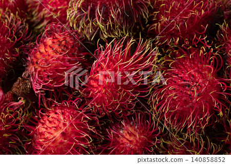 Close-up of fresh rambutan fruit texture background, Tropical summer fruit in Thailand Close-up of fresh rambutan fruit texture background, Tropical summer fruit in Thailand 140858852