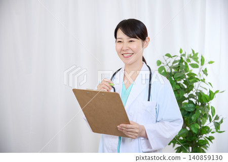 Female doctor explaining to patient Female doctor explaining to patient 140859130