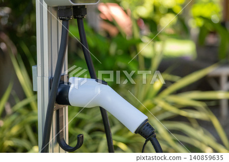 Electric car charging station. Hybrid car Electric charger station in the Car Park. Electric car charging station. Hybrid car Electric charger station in the Car Park. 140859635