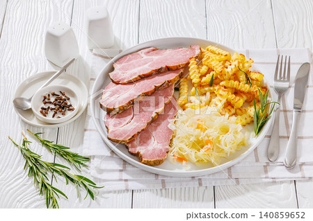 pork neck slices with sour cabbage, french fries pork neck slices with sour cabbage, french fries 140859652