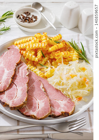 pork neck slices with sour cabbage, french fries pork neck slices with sour cabbage, french fries 140859657