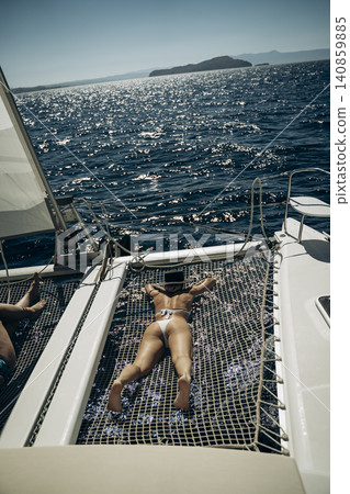 Sunbathing on Yacht Netting in Relaxed Atmosphere Sunbathing on Yacht Netting in Relaxed Atmosphere 140859885
