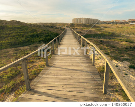 Wooden Boardwalk Path Through Dunes in Furadouro Wooden Boardwalk Path Through Dunes in Furadouro 140860037