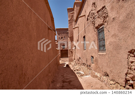 The narrow clay streets reveal the ancient architecture of the Ksar of Ait Benhaddou in southern Morocco. The narrow clay streets reveal the ancient architecture of the Ksar of Ait Benhaddou in southern Morocco. 140860234
