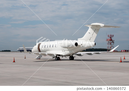 Modern white executive aircraft with an opened gangway door at the airport Modern white executive aircraft with an opened gangway door at the airport 140860372