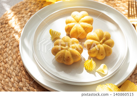Pumpkin shaped muffins featuring autumn harvest treats Pumpkin shaped muffins featuring autumn harvest treats 140860515