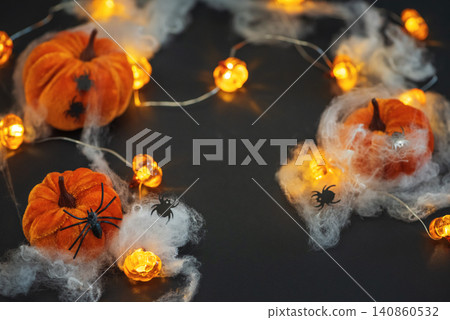 Halloween velvet pumpkins decorating with spooky spiders and lights Halloween velvet pumpkins decorating with spooky spiders and lights 140860532
