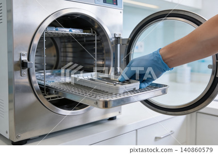 Sterilizing dental instruments in an autoclave for hygiene and safety Sterilizing dental instruments in an autoclave for hygiene and safety 140860579