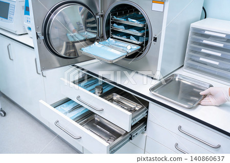 Modern sterilization equipment in a medical lab setting for surgical instruments Modern sterilization equipment in a medical lab setting for surgical instruments 140860637