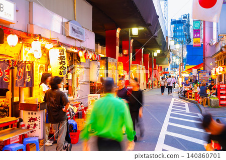 A deep, atmospheric drinking district under the railway tracks near JR Koenji Station in Tokyo. A deep, atmospheric drinking district under the railway tracks near JR Koenji Station in Tokyo. 140860701