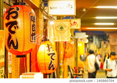 A deep, atmospheric drinking district under the railway tracks near JR Koenji Station in Tokyo. A deep, atmospheric drinking district under the railway tracks near JR Koenji Station in Tokyo. 140860704