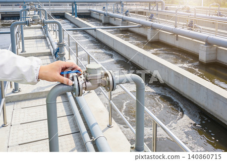 Modern water treatment plant with valves and pipes in operation Modern water treatment plant with valves and pipes in operation 140860715