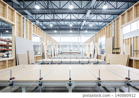 Modern woodworking factory interior with construction materials and machinery Modern woodworking factory interior with construction materials and machinery 140860912