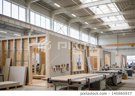 Modern factory producing prefabricated modular building components for construction Modern factory producing prefabricated modular building components for construction 140860937