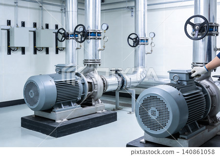 Industrial pumps and piping system in a clean, modern facility Industrial pumps and piping system in a clean, modern facility 140861058