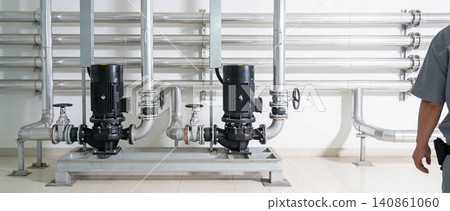 Industrial pumps and piping system in a clean, modern facility Industrial pumps and piping system in a clean, modern facility 140861060