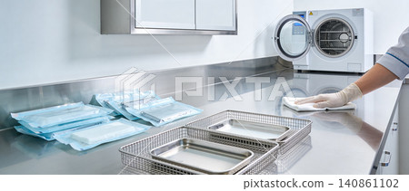 Sterilization process in a modern clinic with autoclaves and sterile instrument packaging Sterilization process in a modern clinic with autoclaves and sterile instrument packaging 140861102