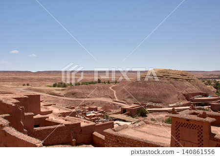 The Ksar of Ait Benhaddou rises majestically above the desert valley of Ouarzazate, Morocco. The Ksar of Ait Benhaddou rises majestically above the desert valley of Ouarzazate, Morocco. 140861556