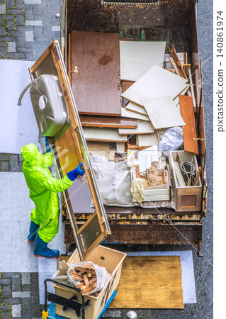 Apartment renovation. Waste materials are being loaded onto trucks one after another = Yokohama City Apartment renovation. Waste materials are being loaded onto trucks one after another = Yokohama City 140861974