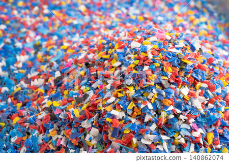 Plastic colorful pieces recycling shredded for industrial use. Plastic colorful pieces recycling shredded for industrial use. 140862074