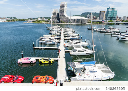 View of Argo Yacht Marina at Glory Pier of Kaohsiung Port, Taiwan, and the Kaohsiung Music Center building. View of Argo Yacht Marina at Glory Pier of Kaohsiung Port, Taiwan, and the Kaohsiung Music Center building. 140862605