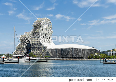 Close-up of Kaohsiung Music Center in Port of Kaohsiung, Taiwan. The white hexagonal building structure on the shore of Love Pier. Close-up of Kaohsiung Music Center in Port of Kaohsiung, Taiwan. The white hexagonal building structure on the shore of Love Pier. 140862606