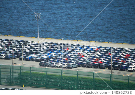 Cars lined up in a port yard, awaiting export overseas. 140862728