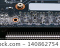 Macro close-up of a graphics card printed circuit board with electronic components, microchips and surface mount devices. Technology, computing and hardware concept 140862754