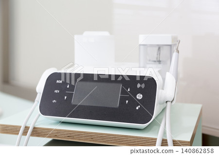 Dental ultrasonic scaler: A close-up of dental treatment equipment. Dental ultrasonic scaler: A close-up of dental treatment equipment. 140862858